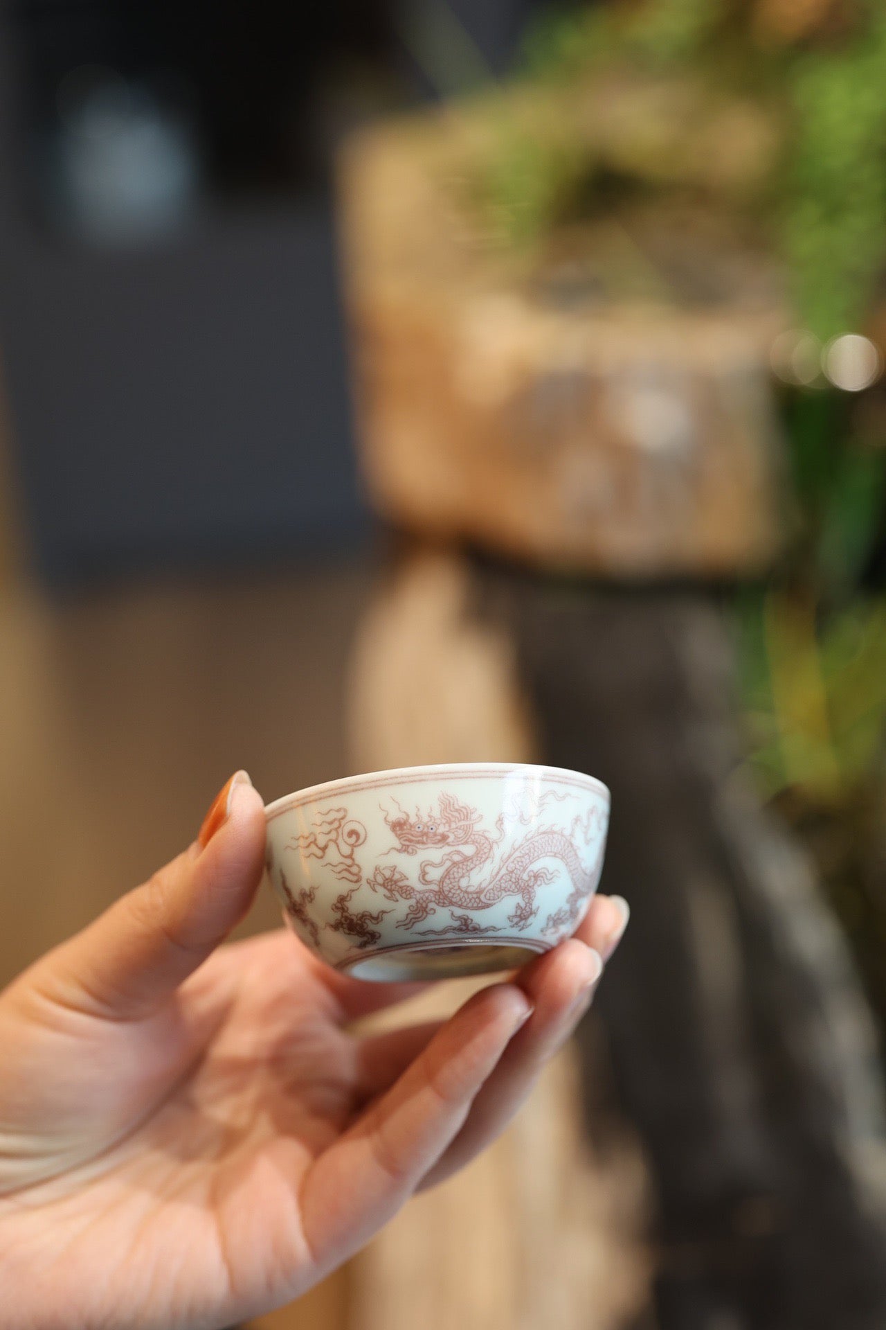 釉里红云龙纹卧足杯
口径：6.8cm
高：3.2cm
满容：65ml